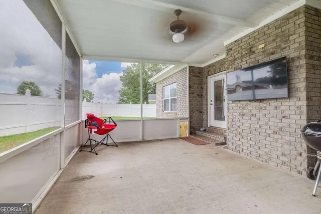 a view of an house with swimming pool and yard