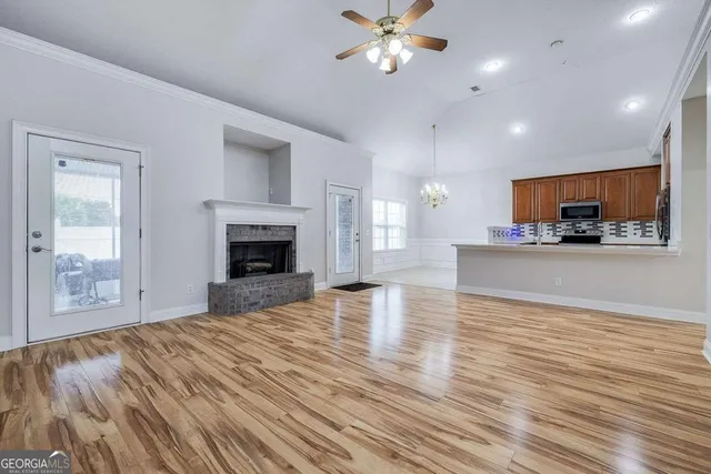 a view of a kitchen with microwave and cabinets