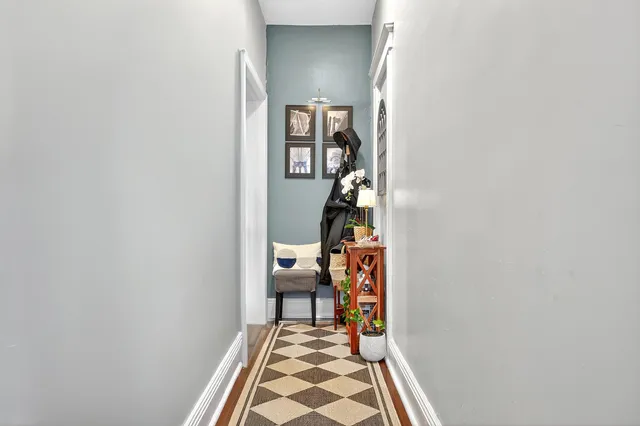 a room that has a rug and a table in it