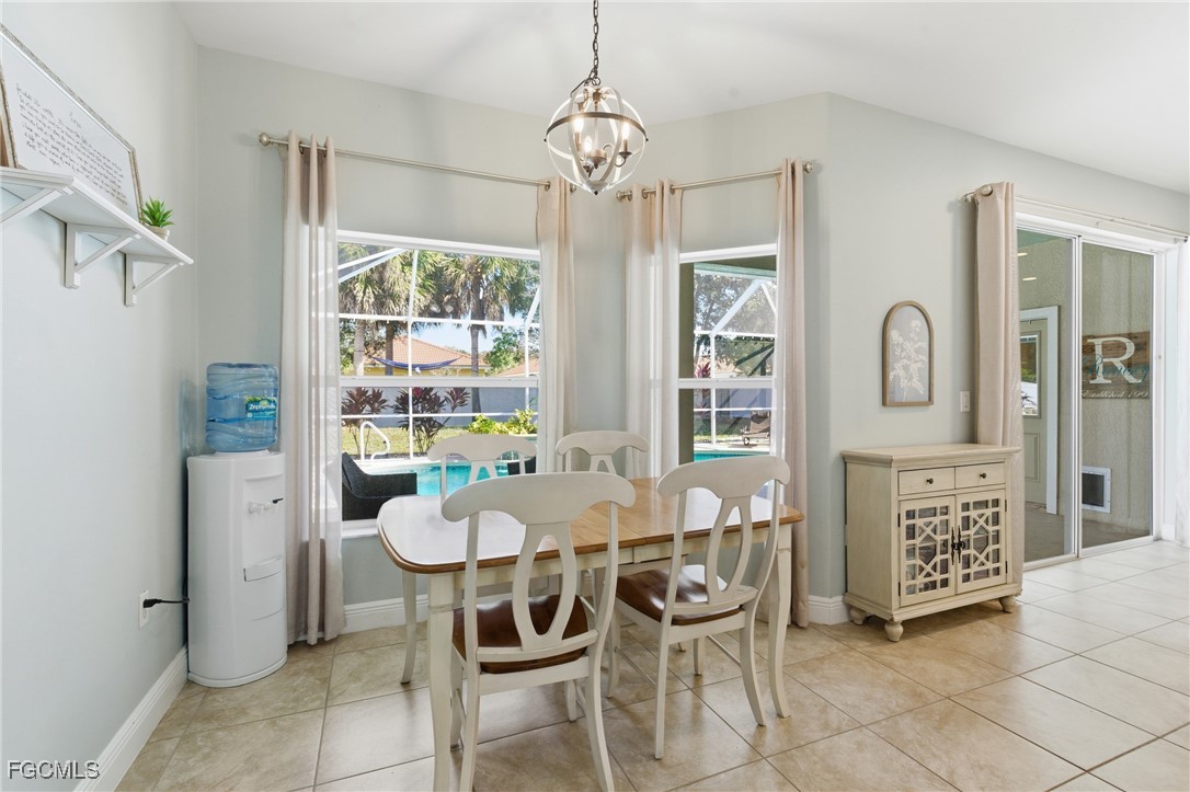 2412 Nature Pointe Loop Fort Myers, FL 33905 - Photo 21 of 44 a view of a dining room with furniture and window