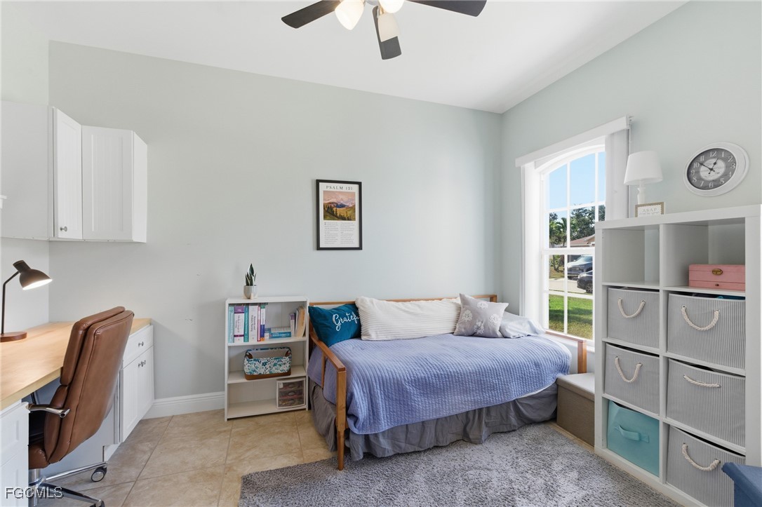 2412 Nature Pointe Loop Fort Myers, FL 33905 - Photo 23 of 44 a bedroom with a bed and a bookshelf