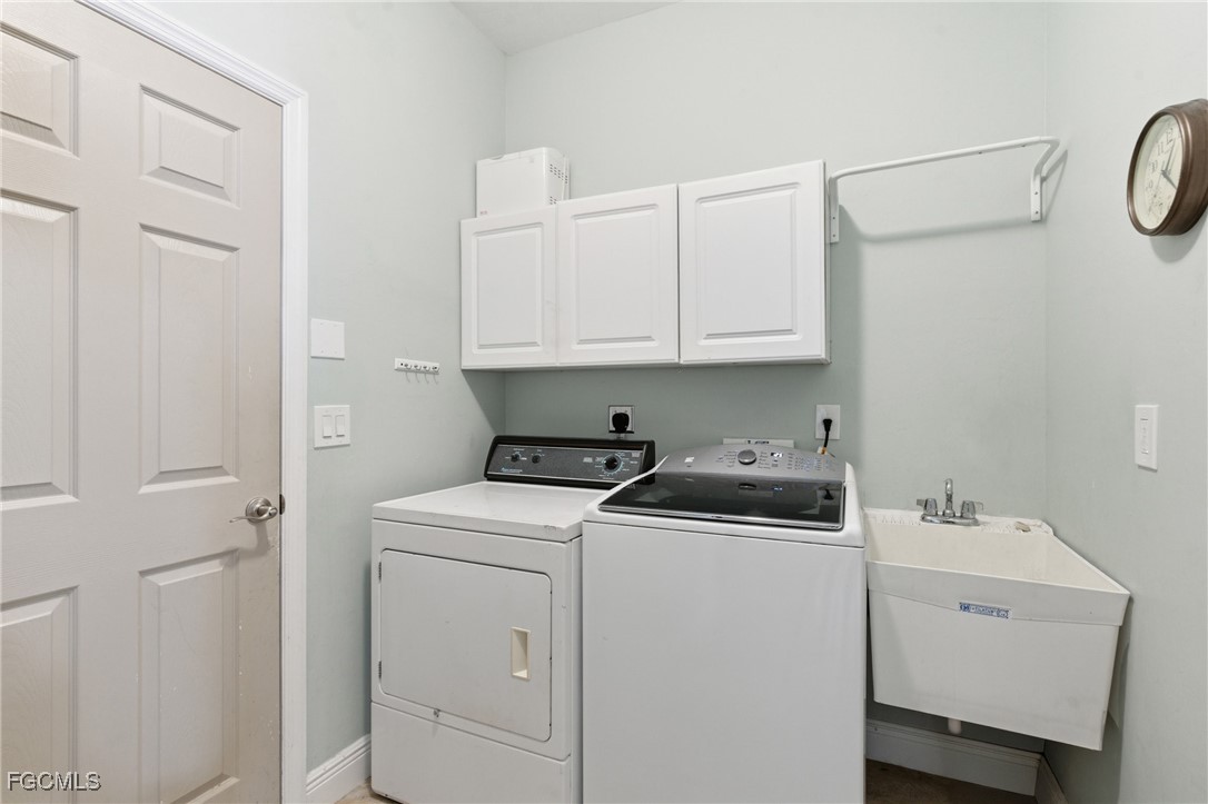 2412 Nature Pointe Loop Fort Myers, FL 33905 - Photo 37 of 44 a view of storage and utility room with washer and dryer