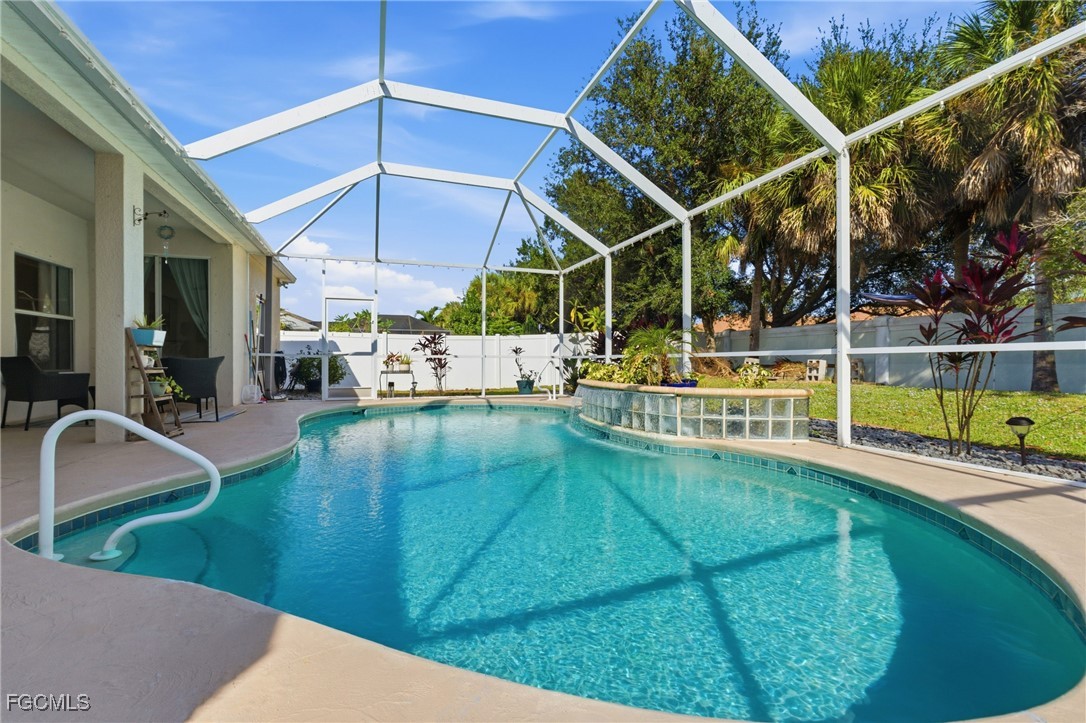 2412 Nature Pointe Loop Fort Myers, FL 33905 - Photo 42 of 44 a view of a swimming pool with a patio