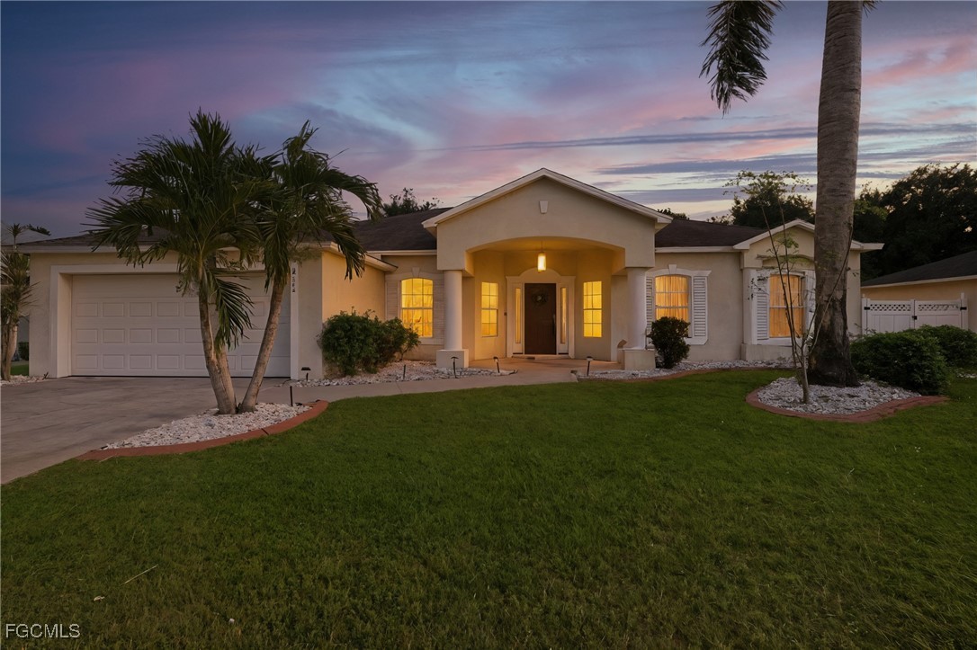 2412 Nature Pointe Loop Fort Myers, FL 33905 - Photo 44 of 44 a front view of a house with garden