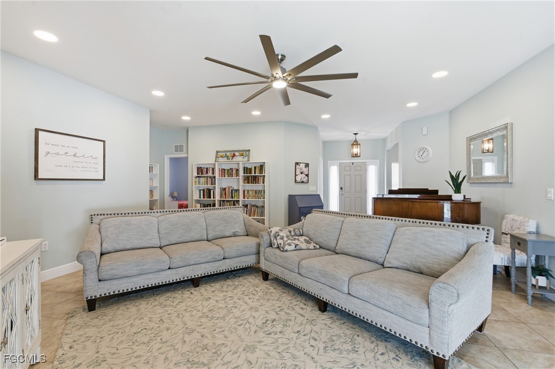 2412 Nature Pointe Loop Fort Myers, FL 33905 - Photo 6 of 44 a living room with furniture and kitchen view