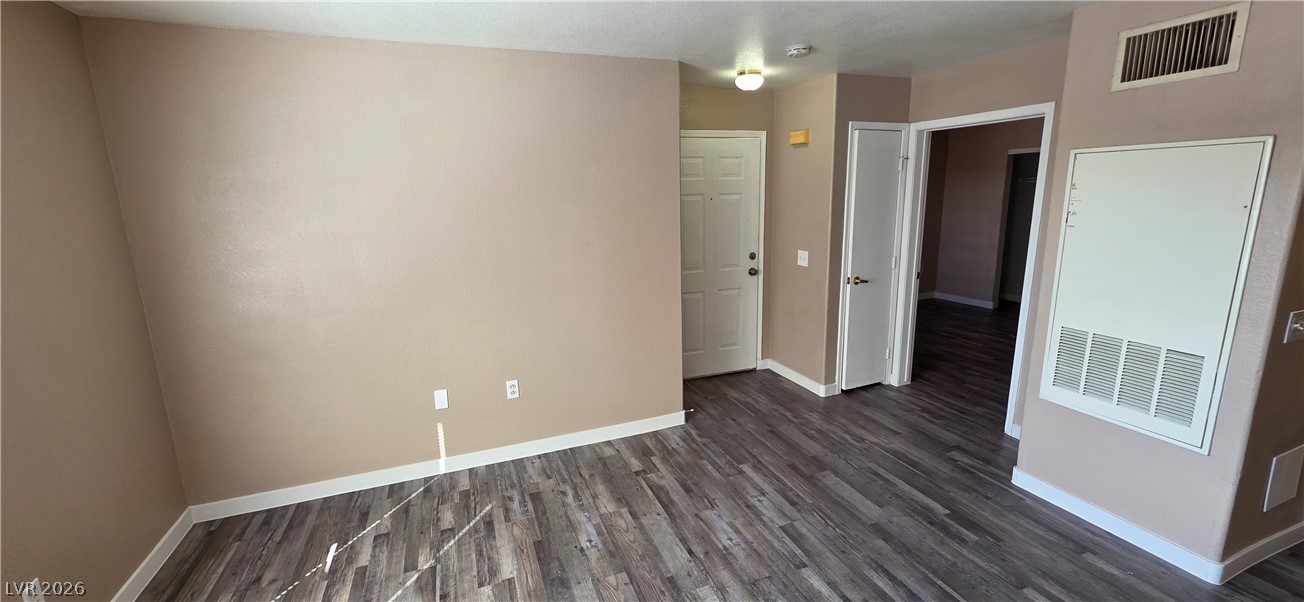 1830 North Pecos Road, Unit 142 Las Vegas, NV 89115 - Photo 7 of 19 Natural light illuminates the durable vinyl plank flooring in this adaptable living space.