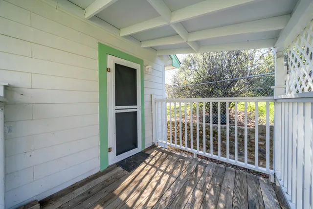 a view of yard with swimming pool and green space