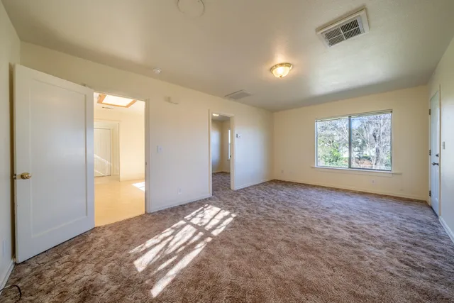a kitchen with sink cabinets and window