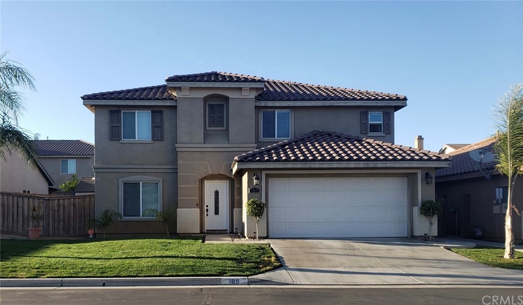185 Ropango Way Hemet, CA 92545 - Photo 1 of 1 a view of a house with a yard plants and large tree