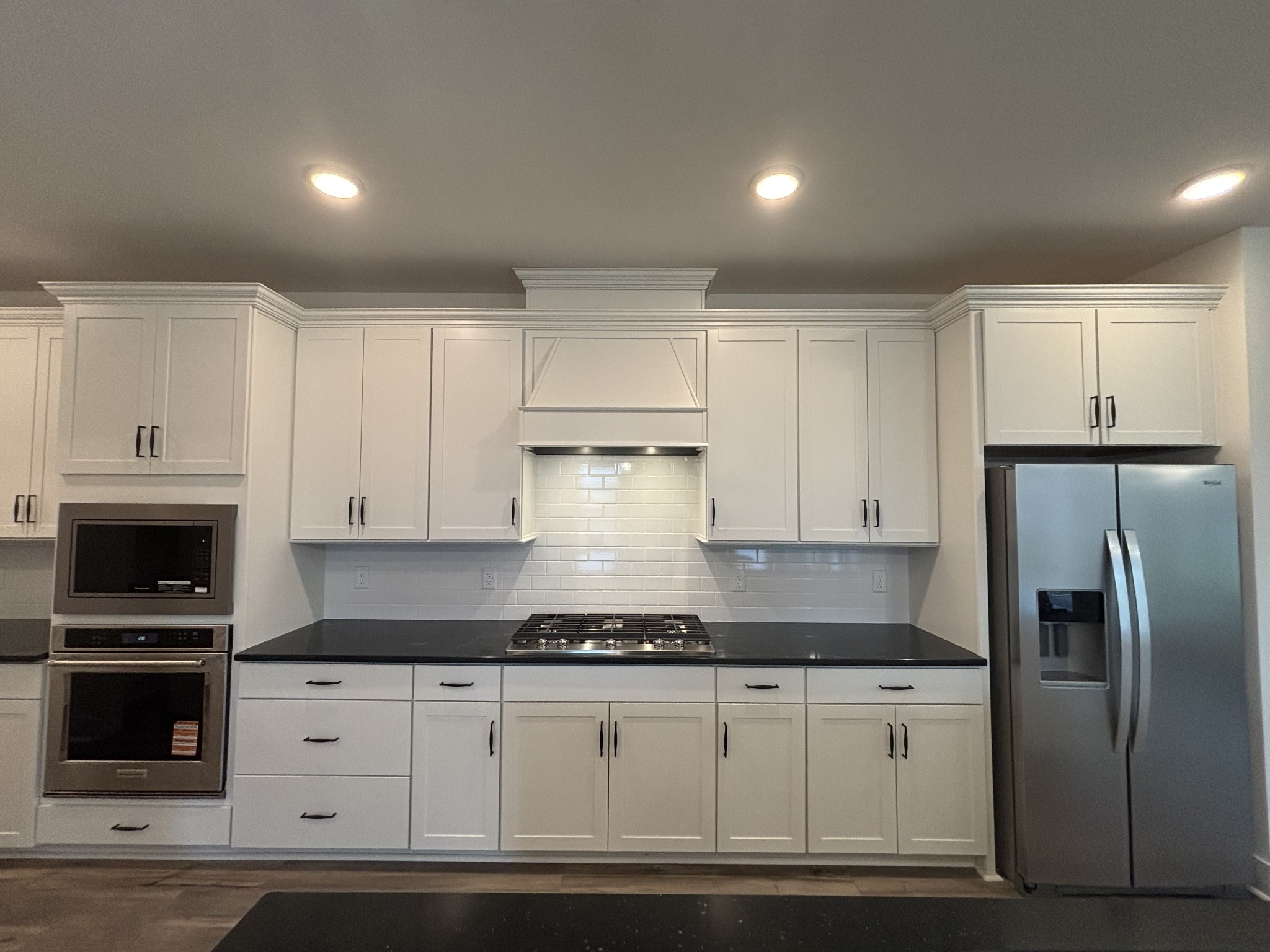 21 Pinnacles Lane Lebanon, TN 37090 - Photo 11 of 81 a kitchen with granite countertop a refrigerator and a stove top oven
