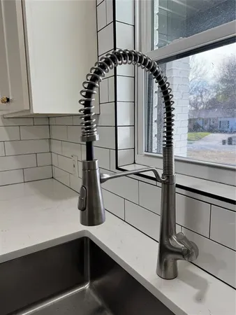 a kitchen with a sink and cabinets