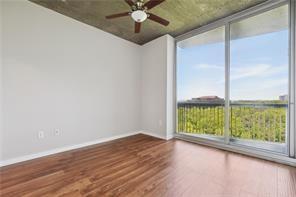 3300 Windy Ridge Parkway Southeast, Unit 913 Atlanta, GA 30339 - Photo 16 of 28 a view of an empty room with wooden floor and a window