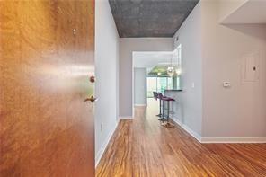 3300 Windy Ridge Parkway Southeast, Unit 913 Atlanta, GA 30339 - Photo 6 of 28 a view of a hallway with wooden floor and staircase