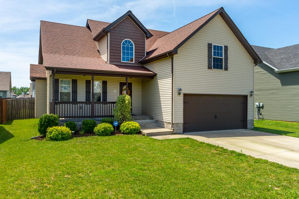 3752 Suiter Road Clarksville, TN 37040 - Photo 1 of 23 a front view of a house with a yard and garage