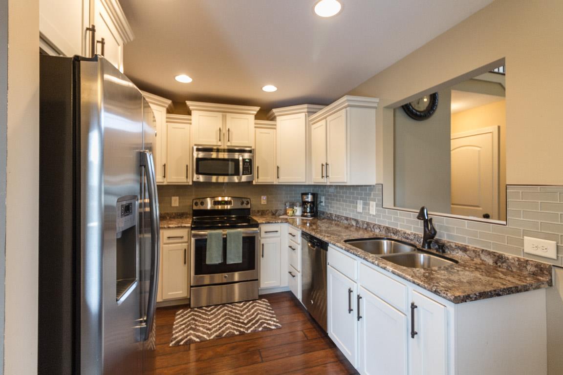 3752 Suiter Road Clarksville, TN 37040 - Photo 7 of 23 a kitchen with a sink stainless steel appliances and cabinets
