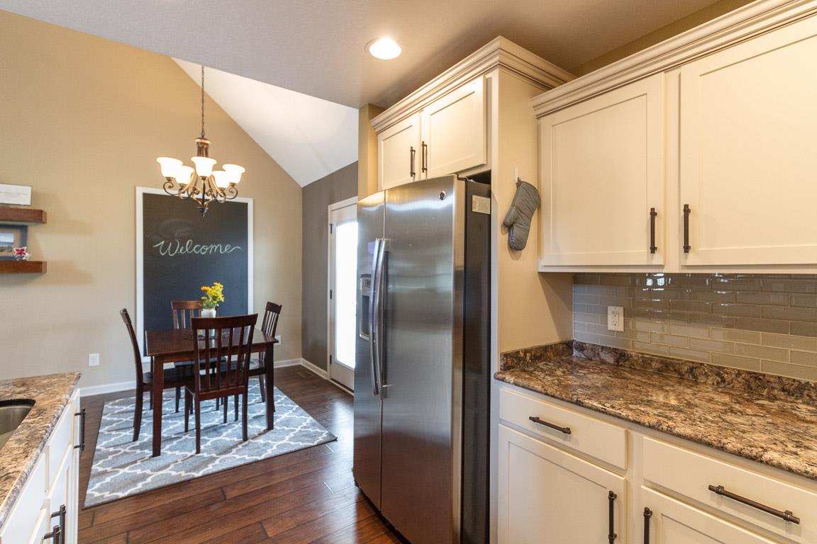 3752 Suiter Road Clarksville, TN 37040 - Photo 8 of 23 a kitchen with stainless steel appliances granite countertop a refrigerator and wooden cabinets
