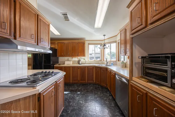 a living room with furniture fireplace and a large window