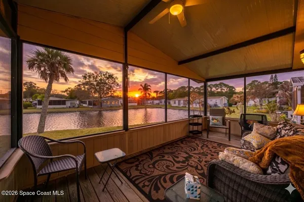 a room with furniture and a large window