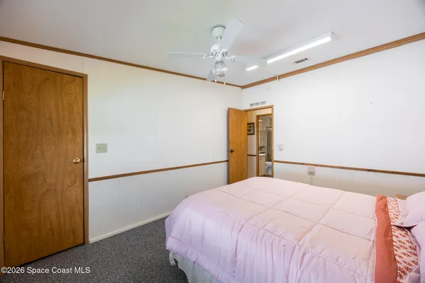 a bed room with a bed and a window