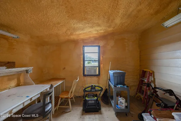 a room with furniture and a large window