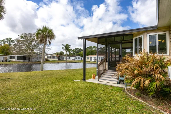 a white house with a small yard