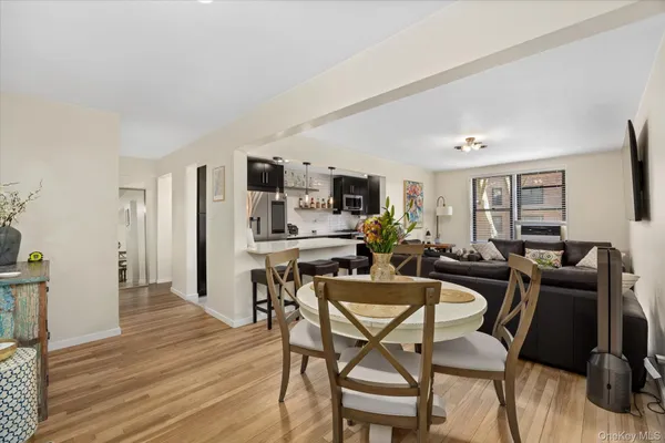 a view of a dining room with furniture and wooden floor