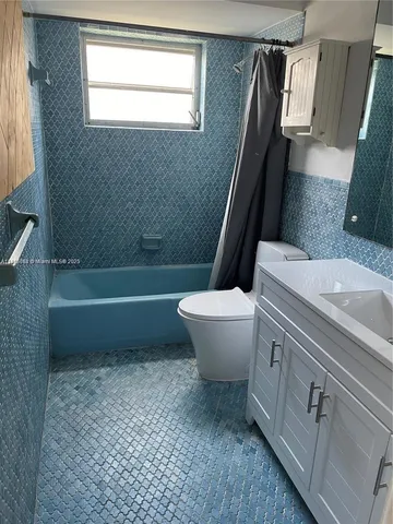 a bathroom with a sink a toilet and a bathtub
