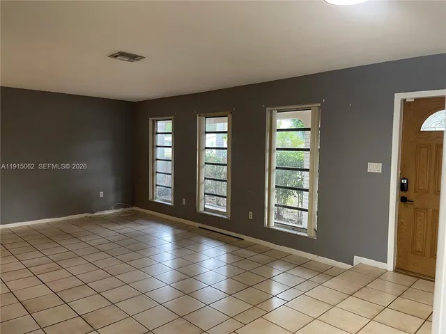 a view of an empty room and window
