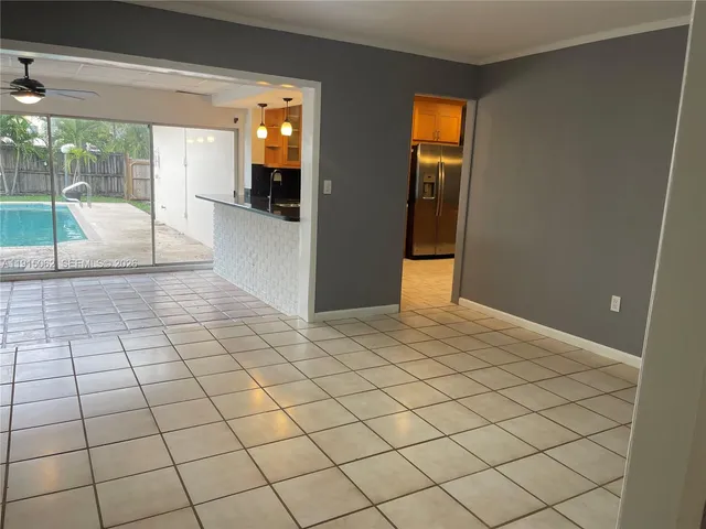 a kitchen with stainless steel appliances granite countertop a sink a stove and a refrigerator