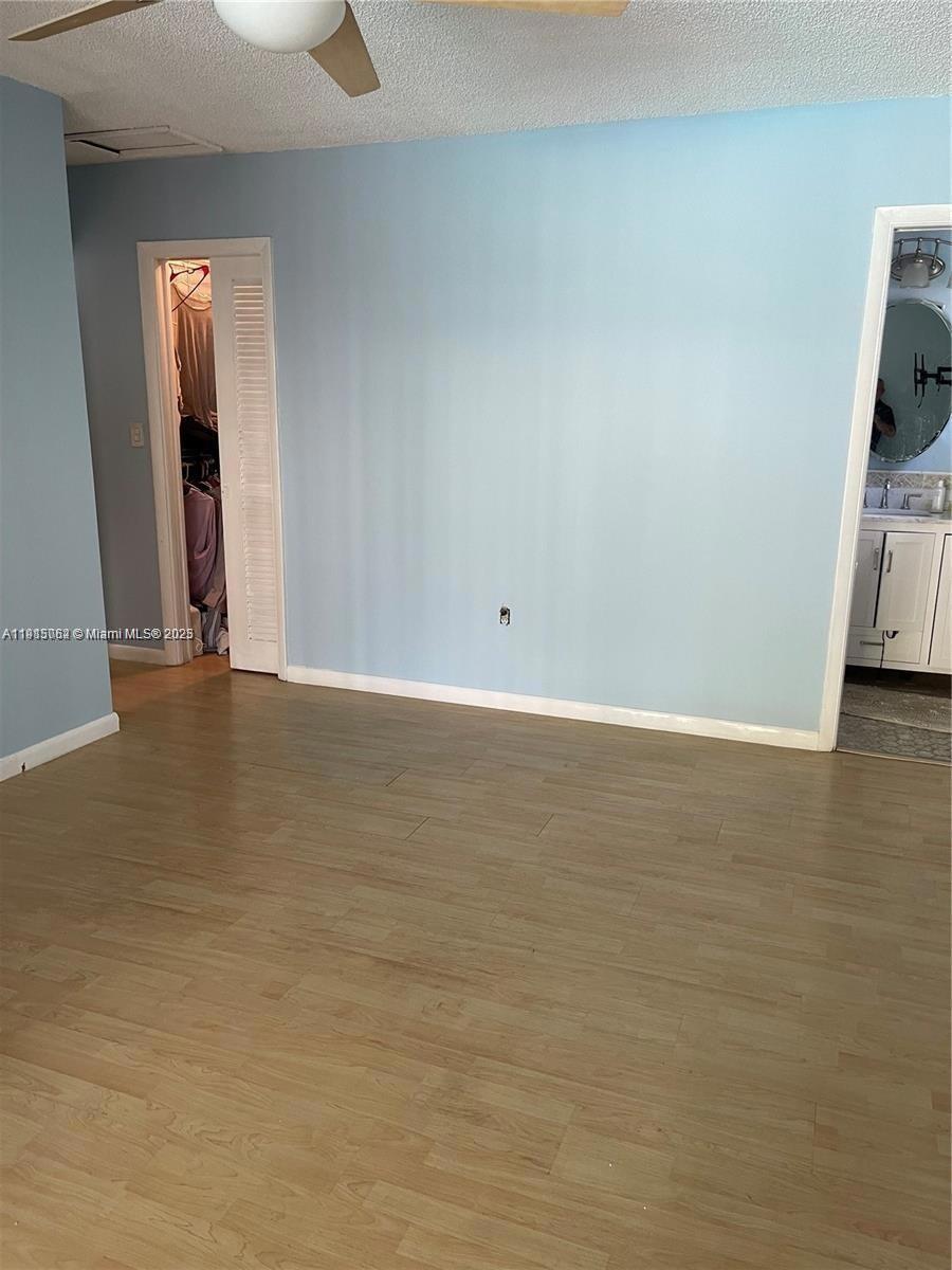 4315 Harrison Street Hollywood, FL 33021 - Photo 15 of 16 a view of an empty room and wooden floor