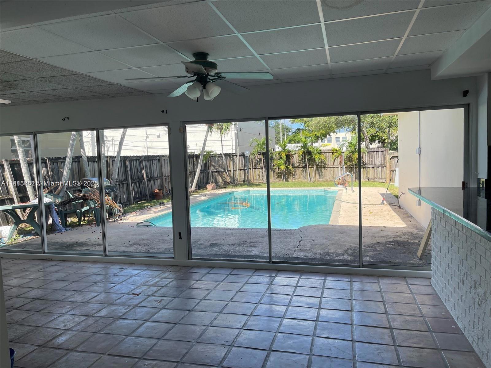 4315 Harrison Street Hollywood, FL 33021 - Photo 2 of 16 a view of a swimming pool with a porch