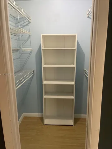 a bathroom with a granite countertop toilet sink and mirror