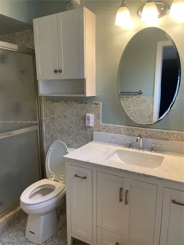 a view of a pathway both side of house