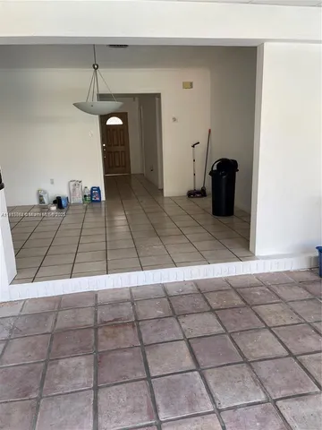 a living room with a black and white checkered floor