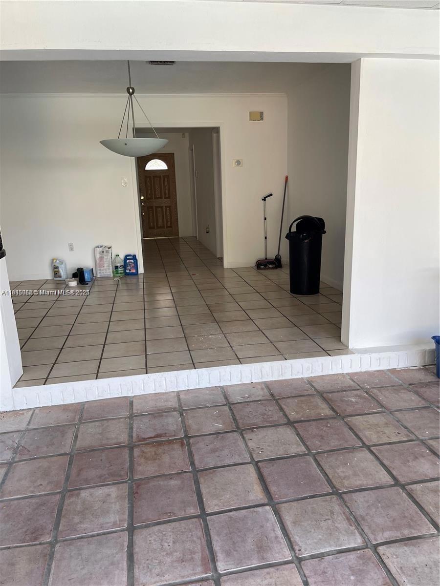 4315 Harrison Street Hollywood, FL 33021 - Photo 8 of 16 a living room with a black and white checkered floor