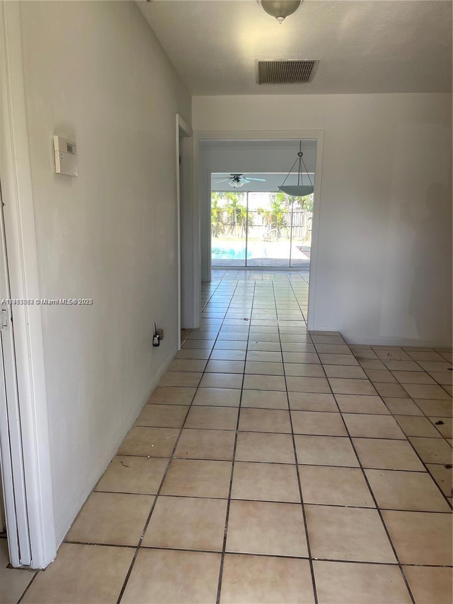 4315 Harrison Street Hollywood, FL 33021 - Photo 9 of 16 a view of a bathroom with white tiles and a window