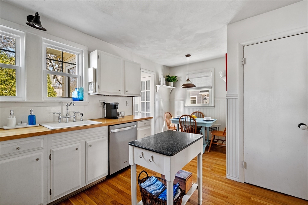 23 Tedesco Street Marblehead, MA 01945 - Photo 13 of 43 a kitchen with a sink a stove and wooden floor