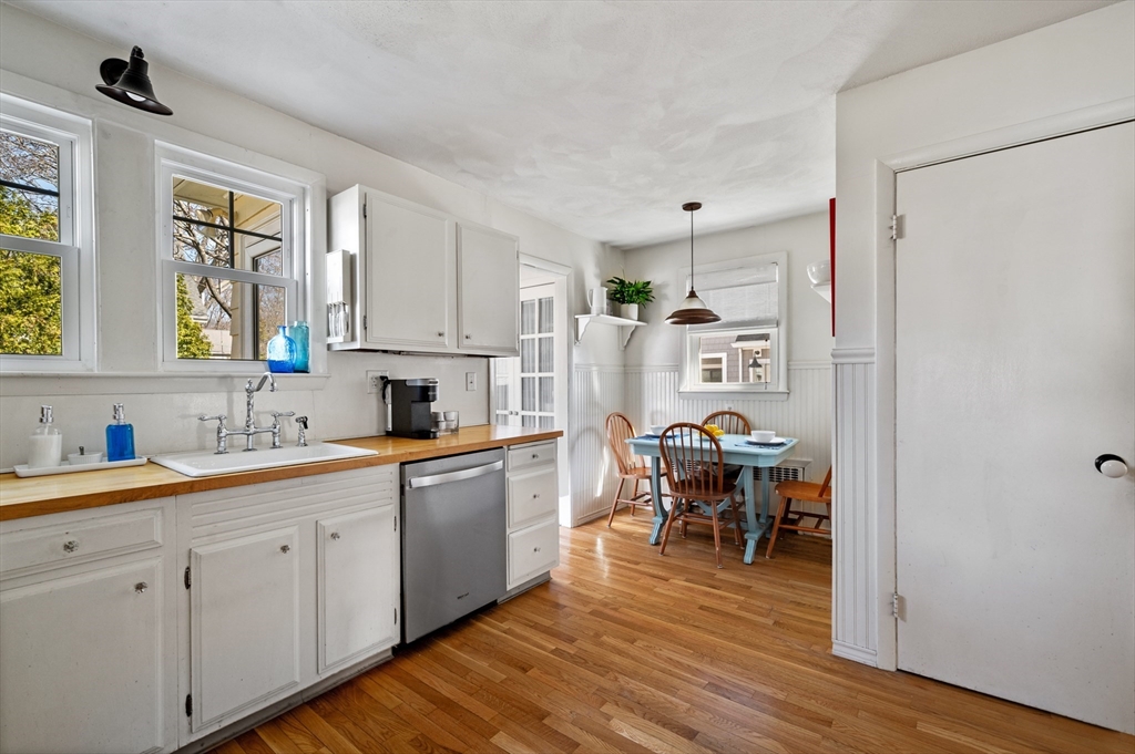 23 Tedesco Street Marblehead, MA 01945 - Photo 14 of 43 a kitchen with a sink cabinets and wooden floor