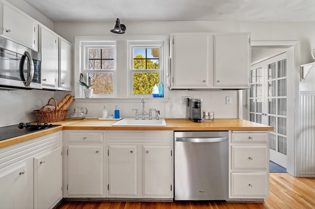 23 Tedesco Street Marblehead, MA 01945 - Photo 17 of 43 a kitchen with cabinets appliances a sink and a window