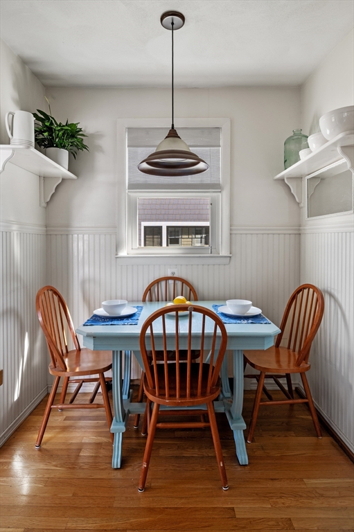 23 Tedesco Street Marblehead, MA 01945 - Photo 19 of 43 a dining room with furniture a chandelier and wooden floor