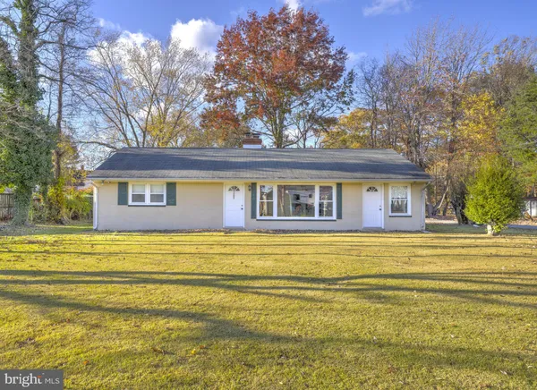 a front view of a house with a ocean view