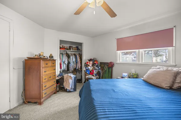 a bed room with a bed and a window