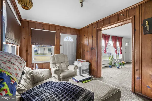 a bedroom with furniture and a window