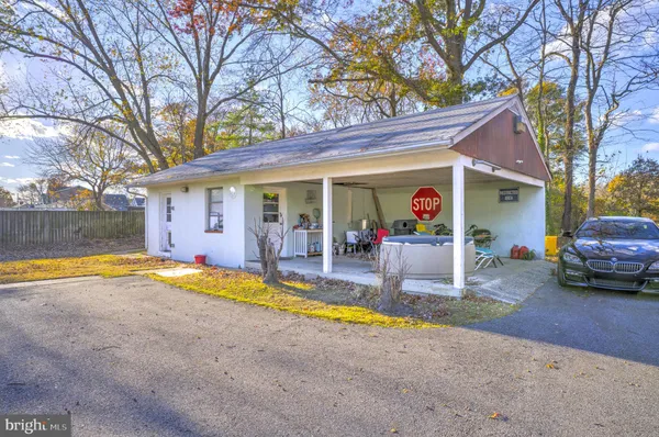 a view of a house with swimming pool and a yard