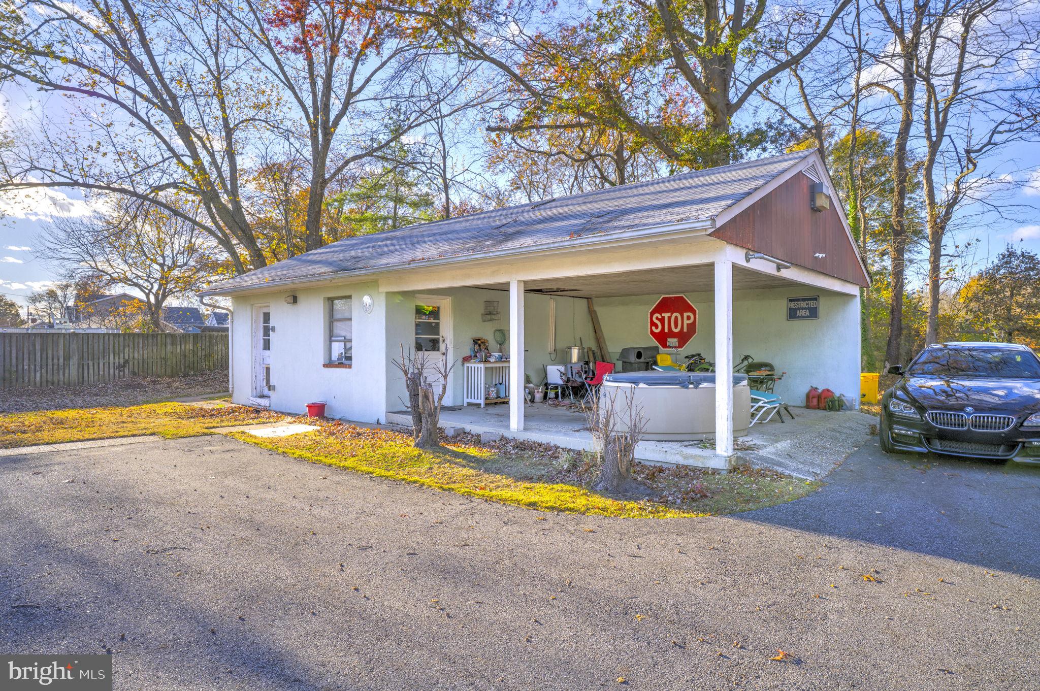 6040 Melbourne Avenue Deale, MD 20751 - Photo 4 of 37 a view of a house with swimming pool and a yard
