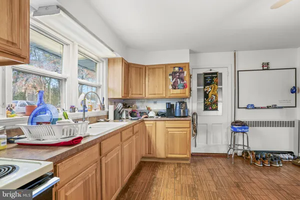 a kitchen with a sink cabinets and window