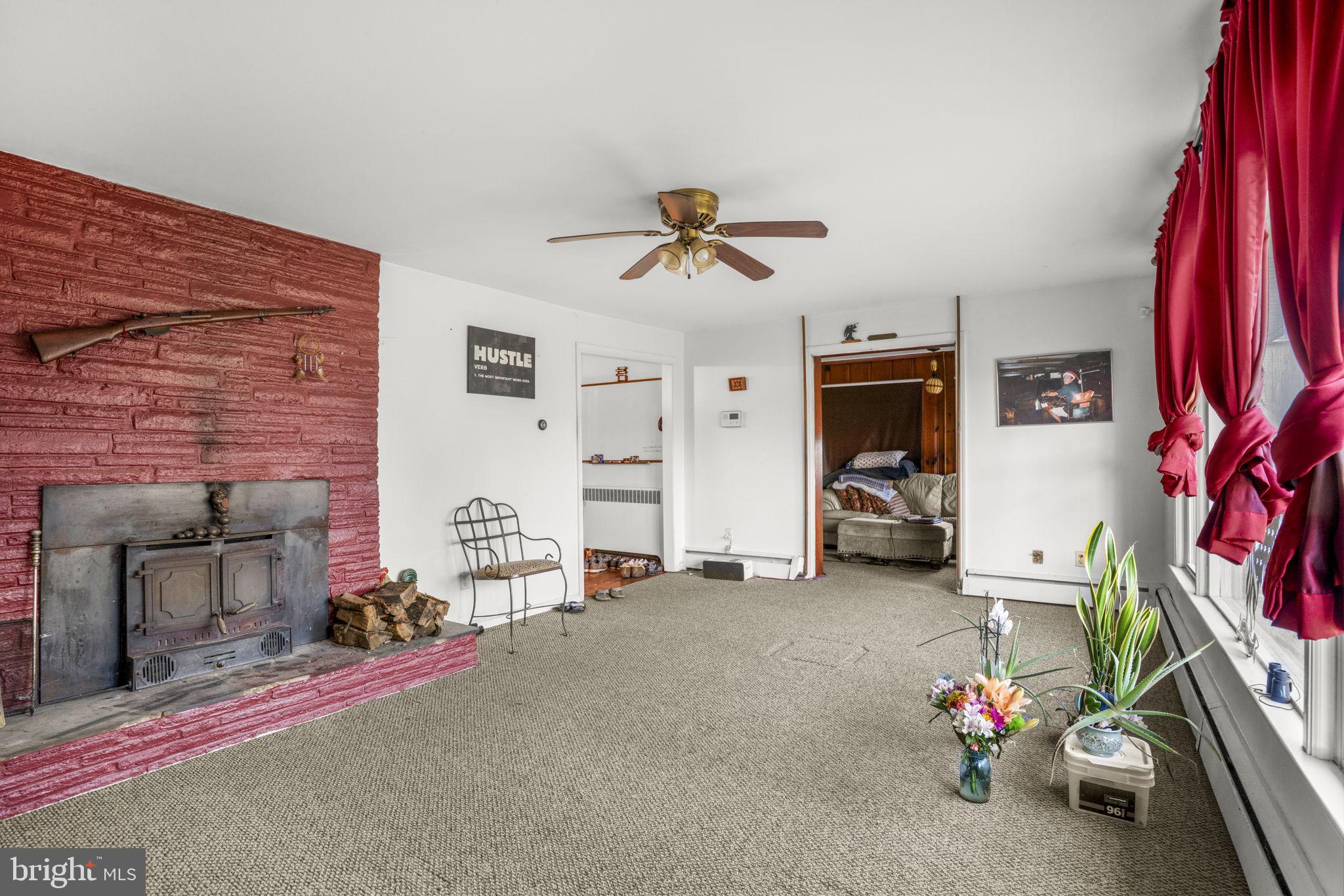 6040 Melbourne Avenue Deale, MD 20751 - Photo 8 of 37 a view of a livingroom with furniture and a fan