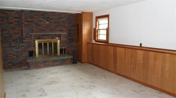 7 Patricia Road Billerica, MA 01821 - Photo 12 of 18 a view of an empty room with window and fire place