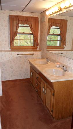 7 Patricia Road Billerica, MA 01821 - Photo 14 of 18 a bathroom with a sink and a window
