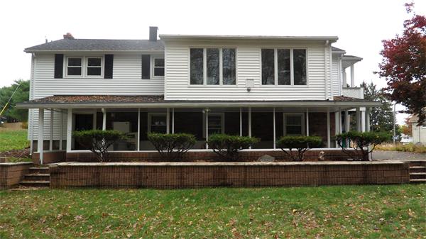 7 Patricia Road Billerica, MA 01821 - Photo 18 of 18 a front view of a house with a yard and a table